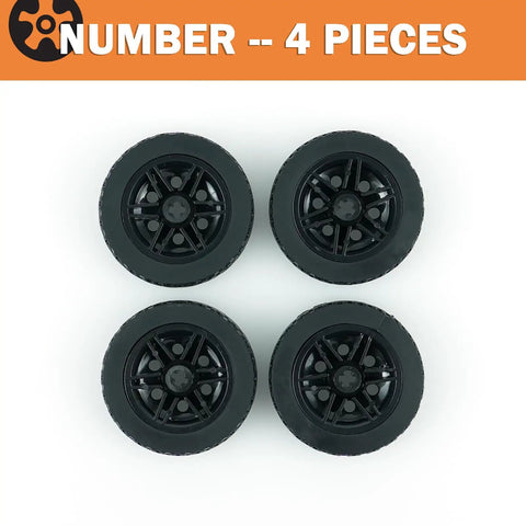 Four Piece Tech Wheels And Tires Set With 43.2x14mm Tires And 30x14mm Rims for RC cars, top view of black wheels.