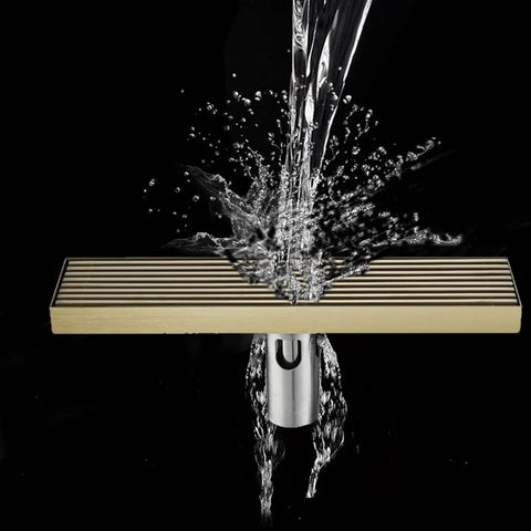 Built Tough Brushed 304 Stainless Steel Linear Shower Drain With Quick Release Hair Catcher 31.5 Inch Rectangular Floor Grate with water splashing.