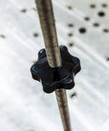 Close-up of Star Shaped Knurled M8 Grippy Clamping Knobs Black Plastic Screw On Type With Threaded Grips on a rod
