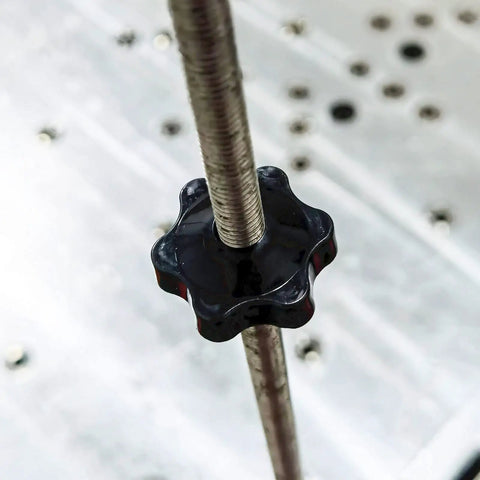 Close-up of Star Shaped Knurled M8 Grippy Clamping Knobs Black Plastic Screw On Type With Threaded Grips on a rod