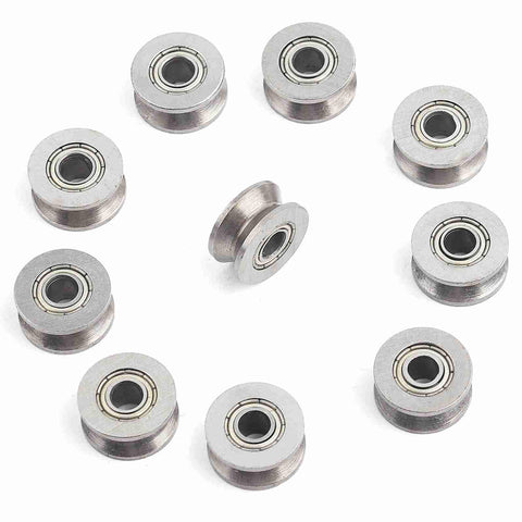 Double Sealed Carbon Steel V Groove Bearing And Pulley Wheel 4X13X6MM arranged in a circle, showcasing smooth ball bearings.