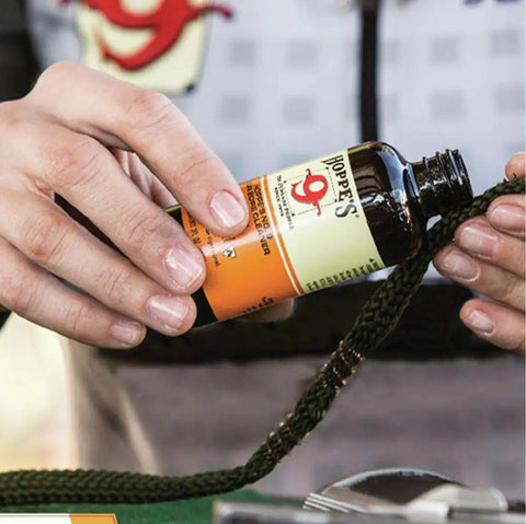 No. 9 Gun Bore Cleaner 16 Oz Bottle With Child Safe Cap being used on rifle bores for smooth firearm maintenance.