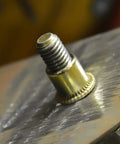Close-up of Carbon Steel Rivet Nuts Threaded Inserts Kit 500 Pcs Galvanized Heavy Duty Fasteners on metal surface