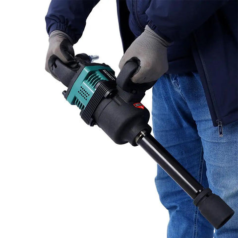 User holding the Badass 1 Inch Air Impact Wrench with Wicked 1900 Ft-Lbs Torque for Crushing Rusty Bolts on Your Rig or Tractor.