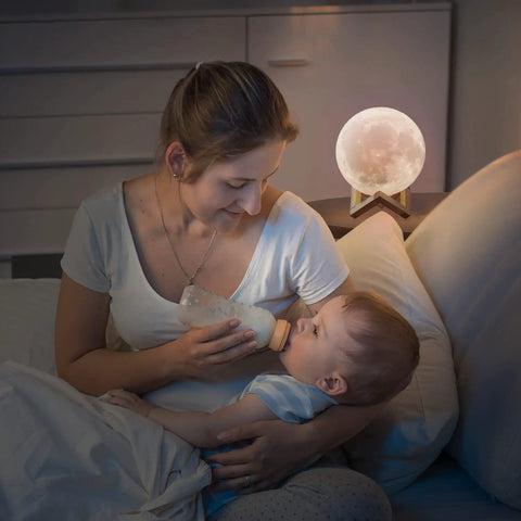 Mother using Kid Safe Nursery Night Light With 128 Color Changing LEDs, Stepless Dimming, Soft Silicone Remote Touch Lamp