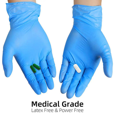 Top Notch Disposable Vinyl Exam Gloves In Steel Blue, Cast At Four Mil Thick For Daily Grind Demands, Zero Latex And Powder, Sharp For Medical Visits Or Quick Kitchen Washes, One Hundred Pack Boxes Ensure Legit Finger Comfort On Every Use, hands wearing gloves holding pills.