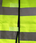 Close-up of Must Have High Visibility Reflective Safety Vest 10 Pack Neon Yellow Gear For Outdoor Work And Play showing material and reflective strips.