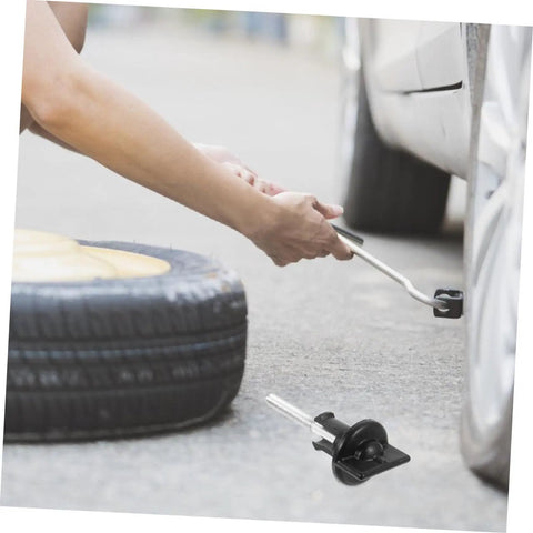 Spare Tire Bolt Retainer Clamp For Trucks And SUVs, Quick Release Hold Down Accessory in use during tire change.