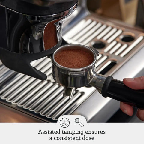 Barista Express Impress Espresso Machine With Impress Puck System And Smart Dosing for Home Third Wave Coffee Nerds, close-up of portafilter with coffee grounds.