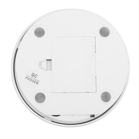 Bottom view of electric rotary display stand showing quality control stamp and battery compartment for 360 degrees rotation use.