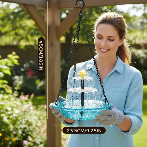 Woman holding a Solar Powered Cascade Hanging Bird Bath Fountain for outdoors; weatherproof garden decor with built-in solar pump.