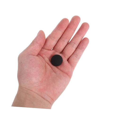 Hand holding a button pin from a 12 Piece Quick Fix Car Headliner Repair Kit With Snap Rivets And Button Pins For Auto Ceiling Fabric Replacement Interior Renovation And Easy DIY Headliner Patch For Automobile Interiors
