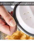 Close-up of Premium Vacuum Sealed Clear Glass Coffee Bean Canister lid with silicone ring for airtight sealing.