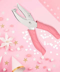 Heart And Star One Quarter Inch Metal Handheld Paper Punch Set With Soft Handled Design on pink background with stars and hearts