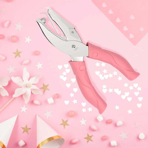 Heart And Star One Quarter Inch Metal Handheld Paper Punch Set With Soft Handled Design on pink background with stars and hearts