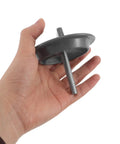 Hand holding Kia Forte spare tire mounting screw and hold down bolt adapter, secure wheel stabilizer, automotive tire support hardware.