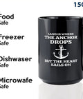 Fifteen Ounce Black Coffee Mug For Lake Lovers And Boat Captains With Land Is Where Theme Funny Boating Gift For Boaters Sailors Lake Life Fans And Outdoor Enthusiasts shown with safety icons for food, freezer, dishwasher, and microwave.