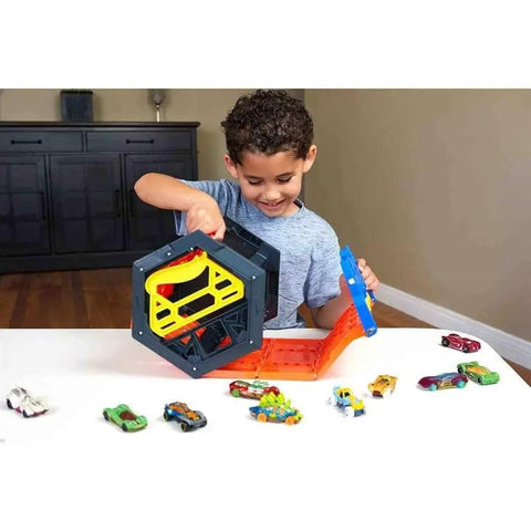 Child using the Roll Out Raceway Track Set With Cool Collapsible Design And Built In Storage For Up To Eighty Die Cast Cars And Five Track Pieces Portable Carry Handle Easy Grab And Go Racing Fun For Kids on a table.