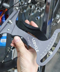 Premium Aluminum Alloy Bicycle Spoke Tension Meter Insanely Accurate Road Bike Wheel Building Tool being used to measure spoke tension.