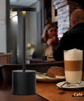 Two Pack Cordless Desk Lamp Rechargeable With 5000mAh Battery on café table with coffee and pastry