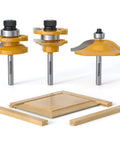 Solid Ogee Router Bit Set For Fine Woodworking With Three Knockout Rail And Stile Cutters featuring three carbide router bits and wood pieces.