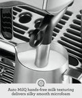 Level Up Your Daily Grind With This Pro Grade Bean To Cup Espresso Machine Featuring A Built In Grinder Automatic Milk Steamer And Sophisticated Black Truffle Design, close-up of Auto MilQ milk texturing pitcher.