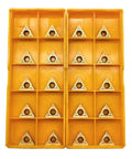 20-piece TCMT21.51 carbide turning inserts in a yellow plastic storage box