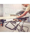 Mobile Miter Saw Stand With Universal Mounting Brackets And Tool Free Extension Lock Quick Release set up in a workshop.