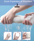 Hands expanding Six Pack Large Compressed Towels That Expand To 56 By 28 Inch Bath Towels When Wet Disposable Cotton Towels