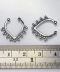 Dope Tribal Multi Dot V Shape Design 14 Gauge 316L Surgical Steel Hoop Clip On Fake Septum Nose Ring next to ruler