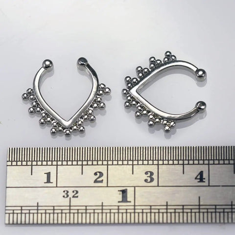 Dope Tribal Multi Dot V Shape Design 14 Gauge 316L Surgical Steel Hoop Clip On Fake Septum Nose Ring next to ruler