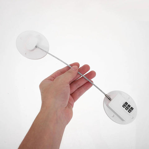 Hand holding Kid Proof Fridge And Cabinet Lock With Password Protection, White Plastic Babyproof Lock for safety in kitchens