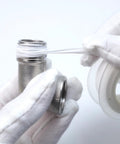 304 stainless steel 90-degree elbow pipe fitting, 1/2" NPT, female x male, with PTFE tape.