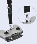 Close-up of an adjustable nylon lanyard attached to DJI Avata FPV Remote, shown in black with metal clasp.