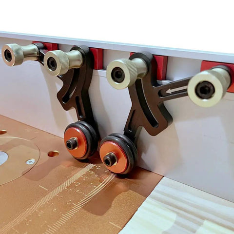 Close-up of Upgraded Router Table Saw Roller Feeder With One Way Bearings And Anodized Aluminum Body for steady wood feed control.