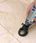 Grout Removal Rotary Tool Attachment For Tile Grout Lines With A 30 Degree Cutting Angle Centered Guides Large Visibility Window And Depth Adjustment To Three Eighths Inch For Wall And Floor Grout By Dremel in use on tile floor