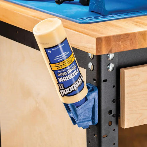 Upside Down Glue Bottle Dock Station With One Handed Access for 4oz, 8oz, and 16oz bottles mounted on a workshop bench.