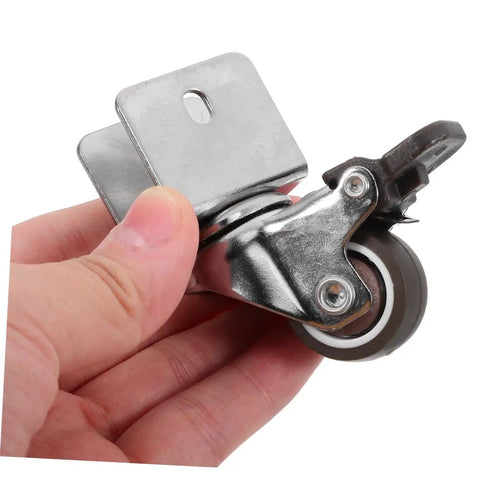 4 Pack Heavy Duty Swivel Casters Rolling Smooth As Silk With Retractable Kickback Locks For Living Room Furniture Workshop Carts And Storage Lockers Rock Solid Setup, close-up of caster wheel in hand.