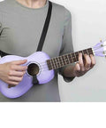 Person wearing Cross Chest Sling For Ukuleles, Mandolins, Classical Guitars And More, Adjustable For Any Size Instrument with gray shirt