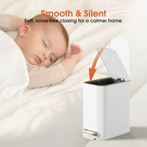 White 5L Slim Stainless Steel Trash Can With Gold Trimmed Lid, Pedal Lid, Soft Close, with sleeping baby in background