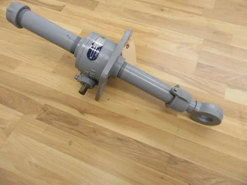 SK1912A Worm Gear Actuator Heavy Duty Built To Last Industrial Grade Linear Motion Unit For Automation, High Torque And Precise Positioning, Durable Gearbox, Easy Mounting For Robots, Conveyors, And Machinery. gray metal worm gear actuator with mounting plate and eyelet