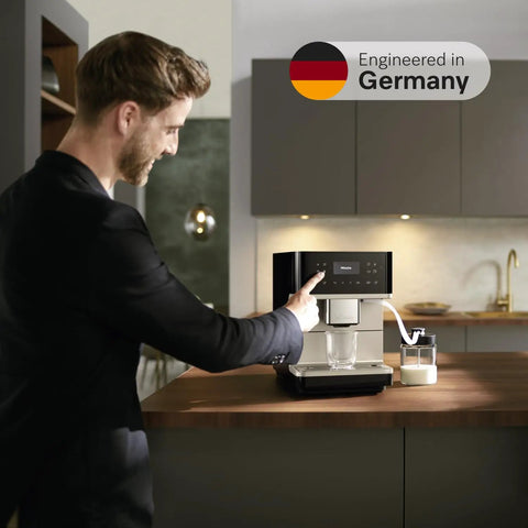 Top Shelf Fully Automatic Coffee And Espresso Maker Featuring Quiet Steel Grinder And Rich Milk Frother, in use on kitchen counter.