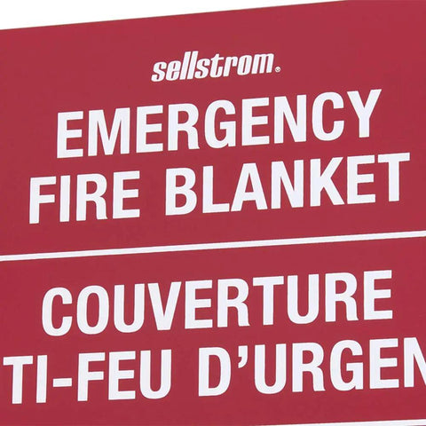 Close-up of Emergency Fire Blanket sign on red steel cabinet for home workshop commercial use wall mount safety kit.