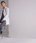 Woman wearing Women's 3 Pocket Lab Coat 32 Inch White 3X Large Soft Touch Fabric Tailored Shoulder Lines Finished Interior Seams