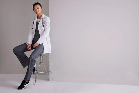 Woman wearing Women's 3 Pocket Lab Coat 32 Inch White 3X Large Soft Touch Fabric Tailored Shoulder Lines Finished Interior Seams