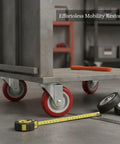 Red Polyurethane Plate Caster Wheel With Brake under industrial cart, floor safe, solid metal housing, surrounded by tools