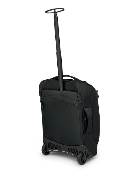 Osprey Ozone 2-Wheel Carry-On luggage, black, side view with extended handle and oversized wheels
