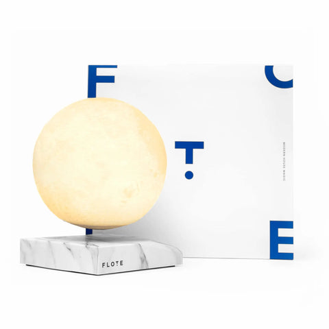 Levitating Moon Lamp With Nonstop Rotation, displayed on a marble base, showcasing magnetic levitation light in three color modes.
