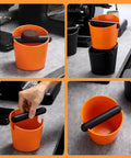 Orange ABS Coffee Knock Box 2.5L open top with non slip base shown with spent espresso grounds on counter.