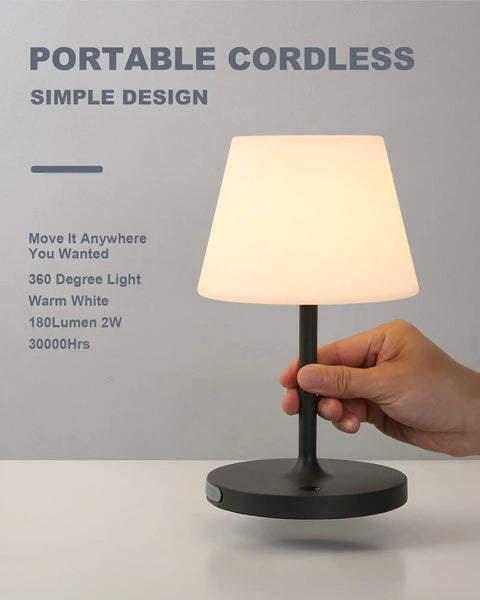 Person touching Cordless Outdoor Table Lamp With 4000mAh Battery Waterproof LED Night Light Touch Dimmable Desk Lamp For Patio Camping Home And Restaurant Portable Dark Grey